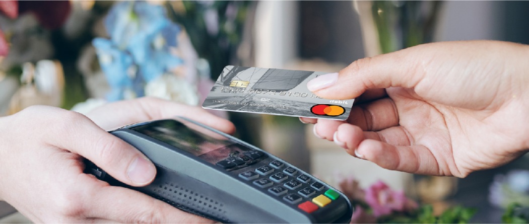 a person paying with a debit/credit card